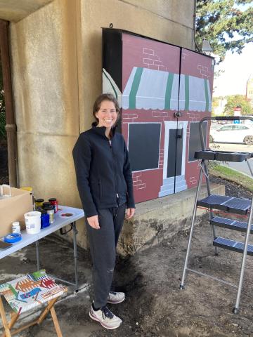 Meghan Sheehan at her painted utility box