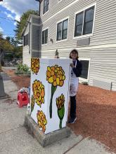 Mary Grassi at her painted utility box