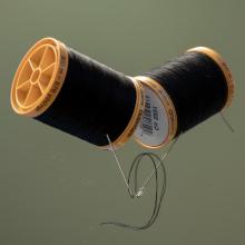 Two spools of thread