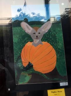 Dog in pumpkin