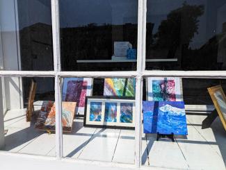Art in August artworks in shop window