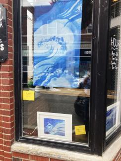 Art in August artworks in shop window