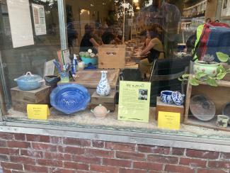 Art in August artworks in shop window