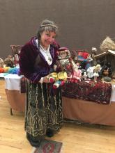 A peasant lady with her puppets